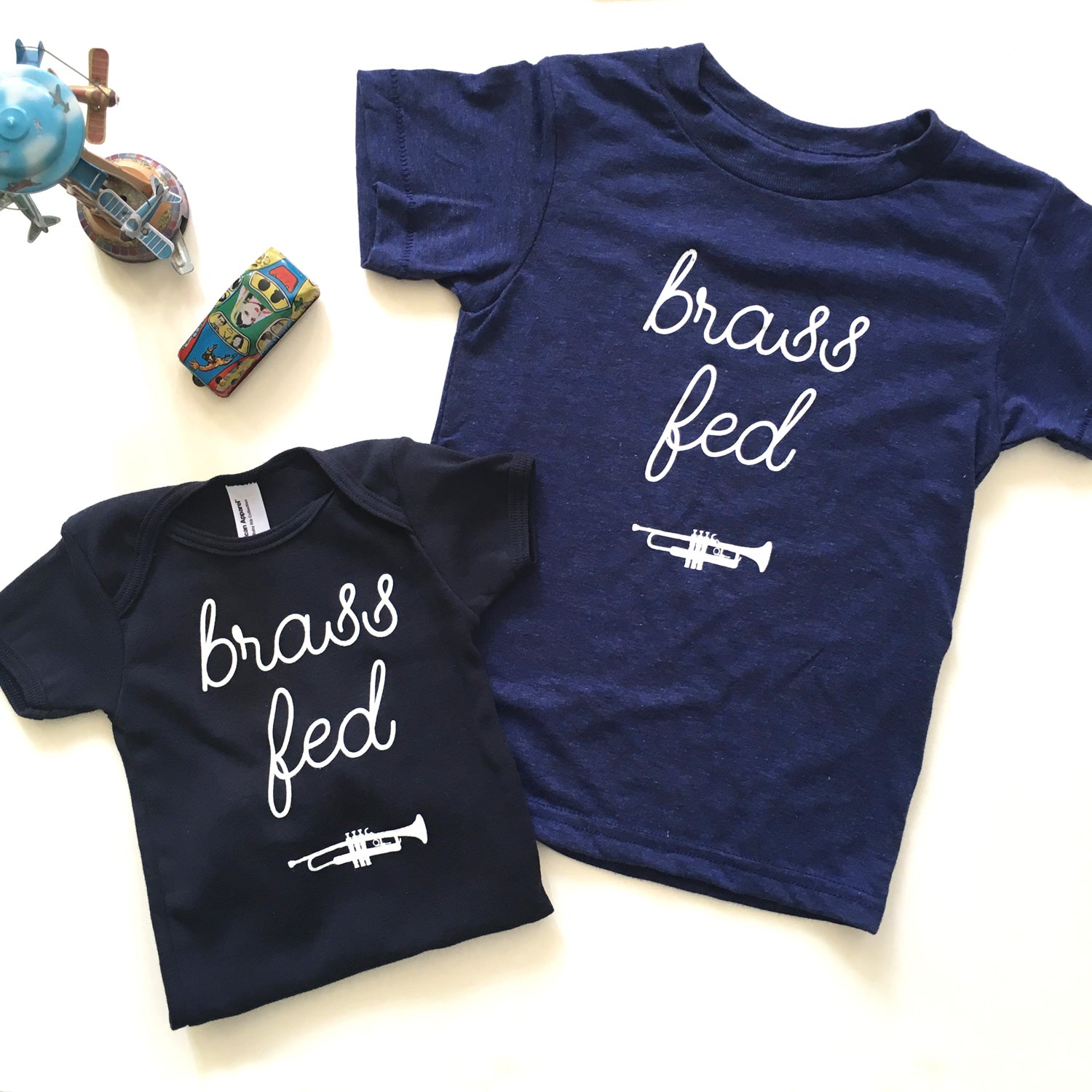 Brass Fed Onesie & Kids Tees